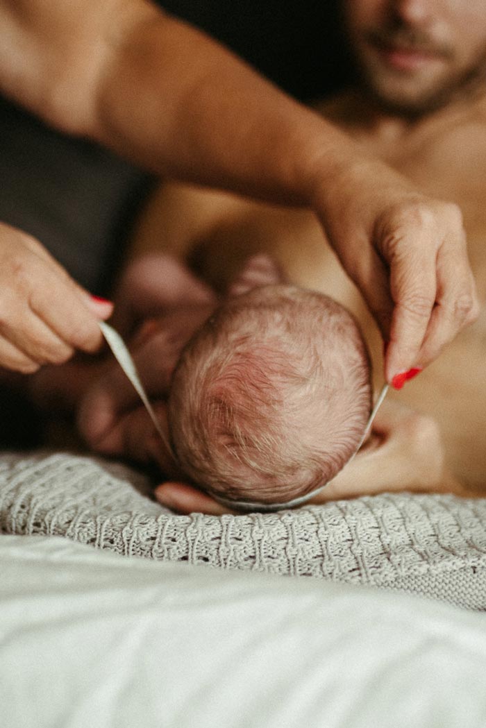 Measuring the head of a newborn baby